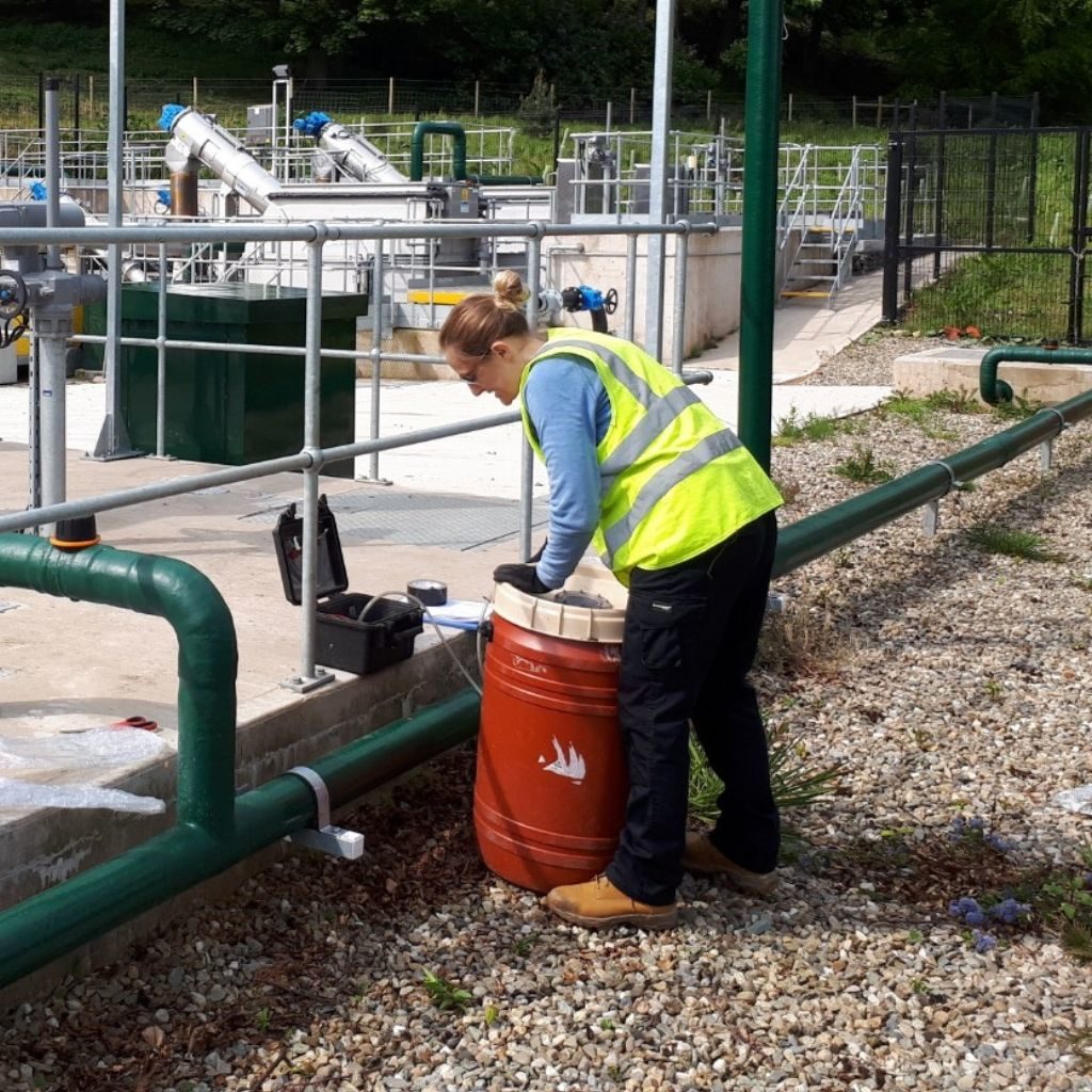 Victoria taking odour samples from a sewage works, demonstrating one of our methods of odour assessment